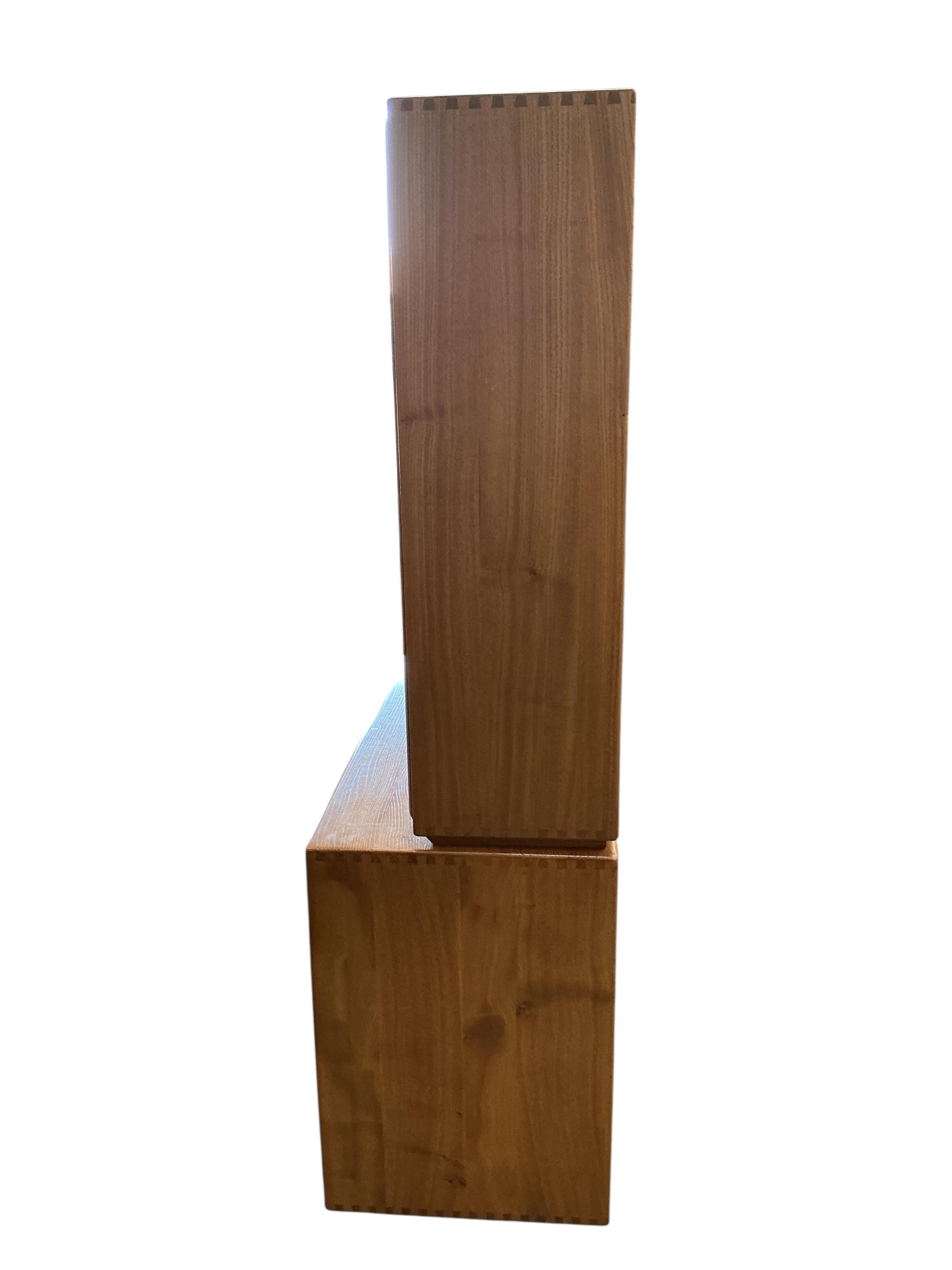 An Ercol Windsor light elm sideboard, width 155cm, depth 44cm, height 162cm